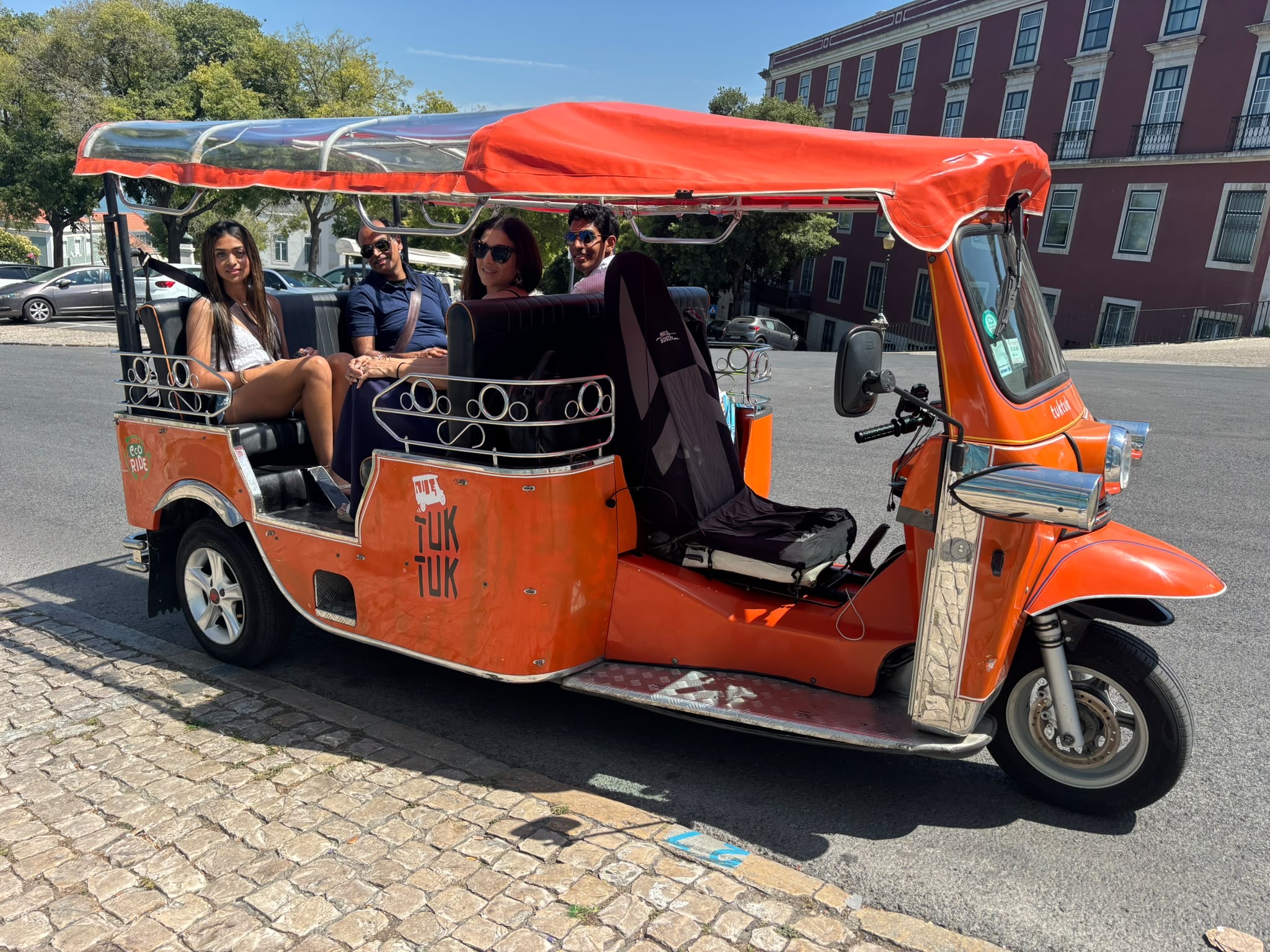 Travel-Luck clients smiling during a tuk-tuk experience in Portugal