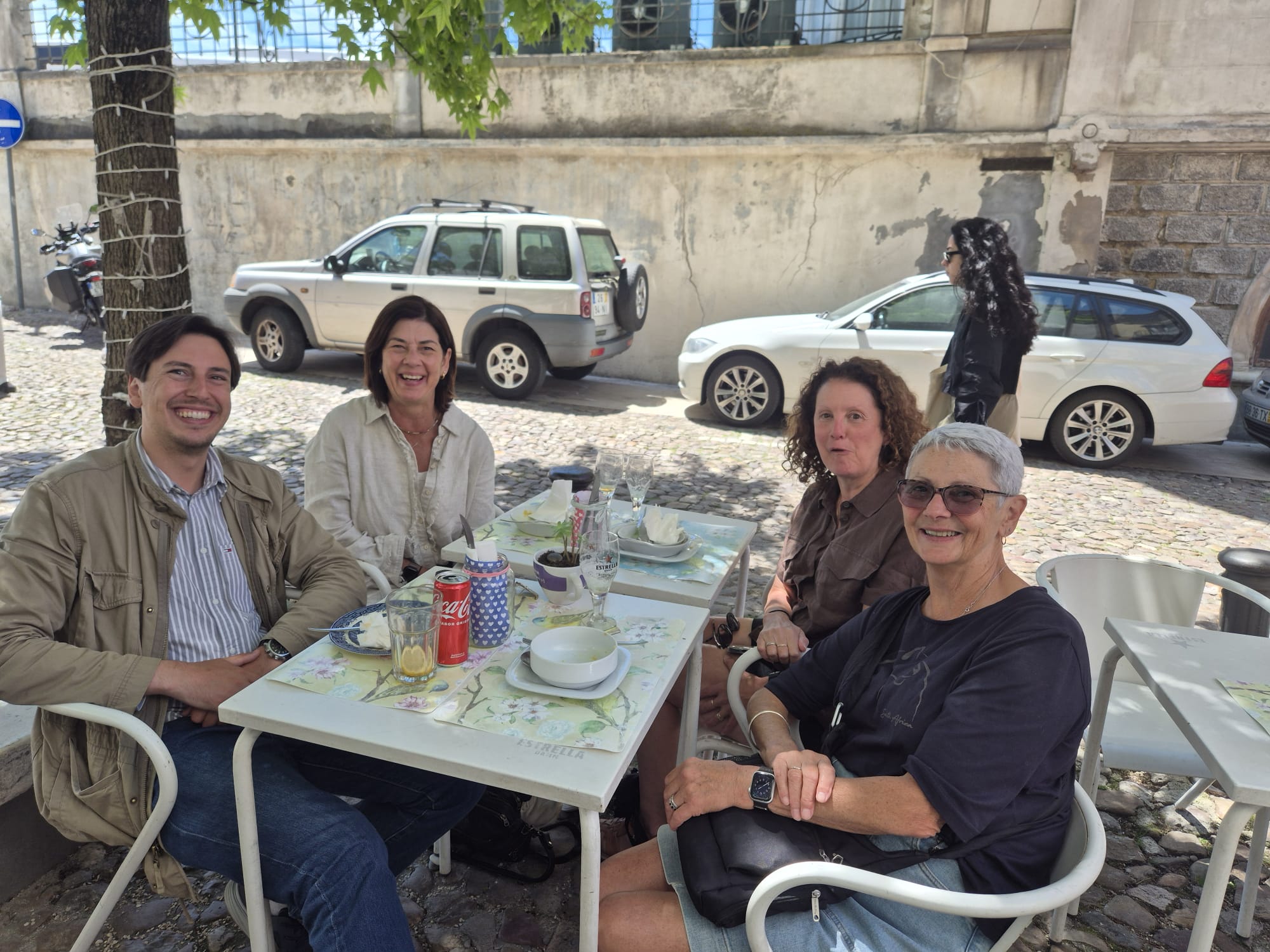 Travel-Luck travelers gathered at an outdoor cafe table