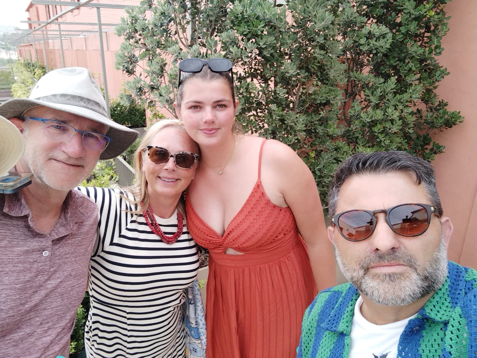 Travel-Luck clients and their guide smiling together outdoors