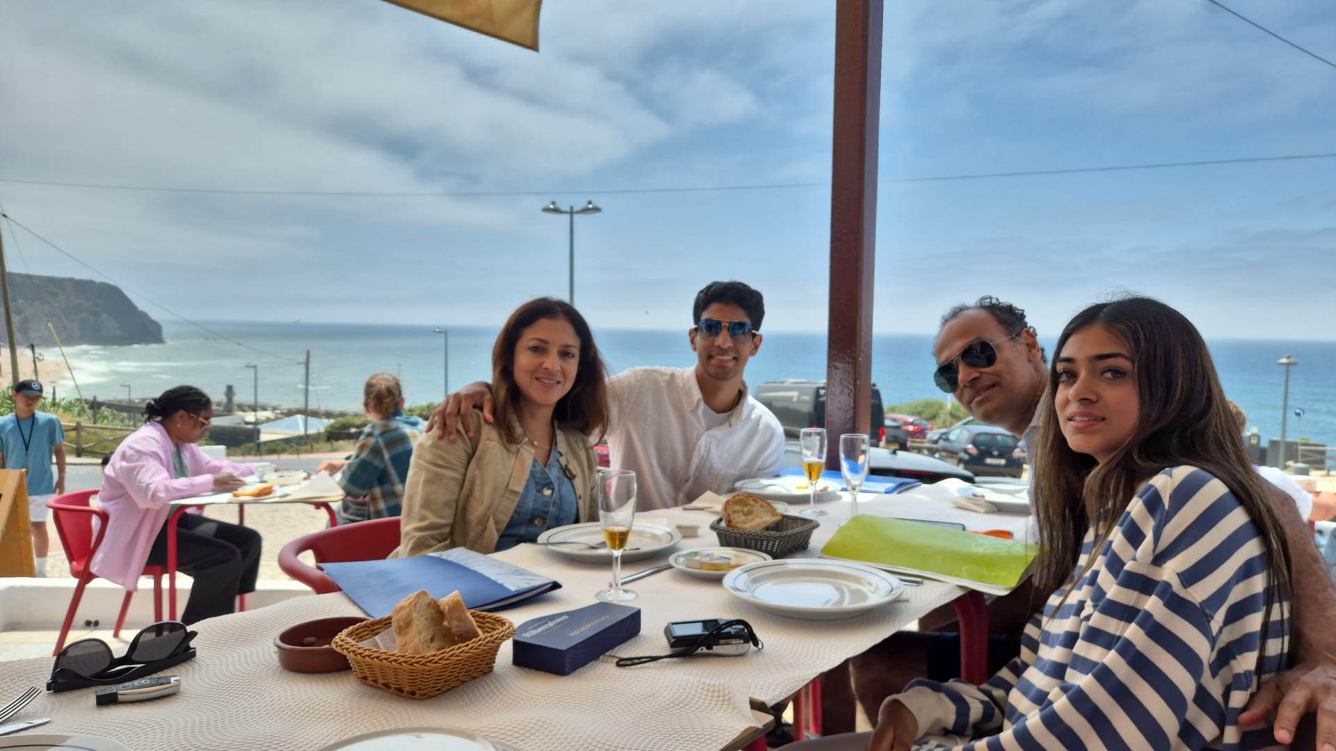 Travel-Luck group enjoying lunch by the water in Portugal