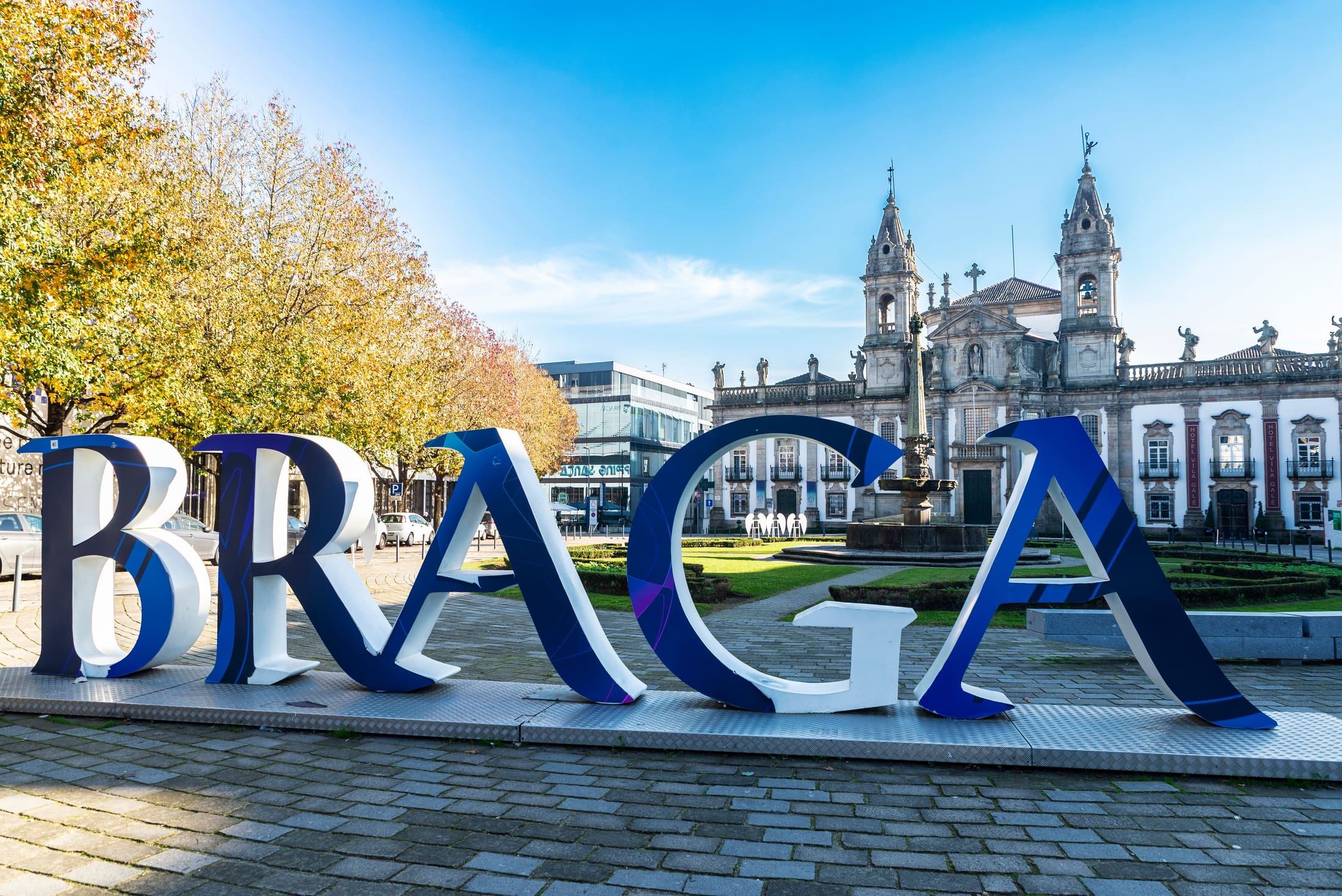 Braga city sign and historic church facade