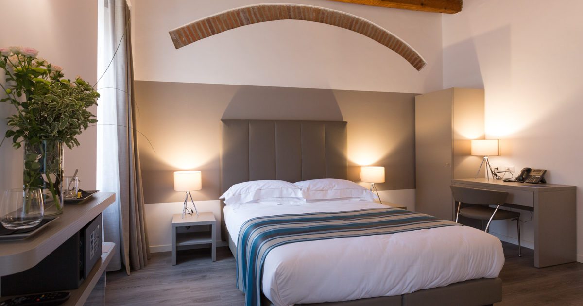 Bedroom shown on the Family Room page of Ai Suma Hotel