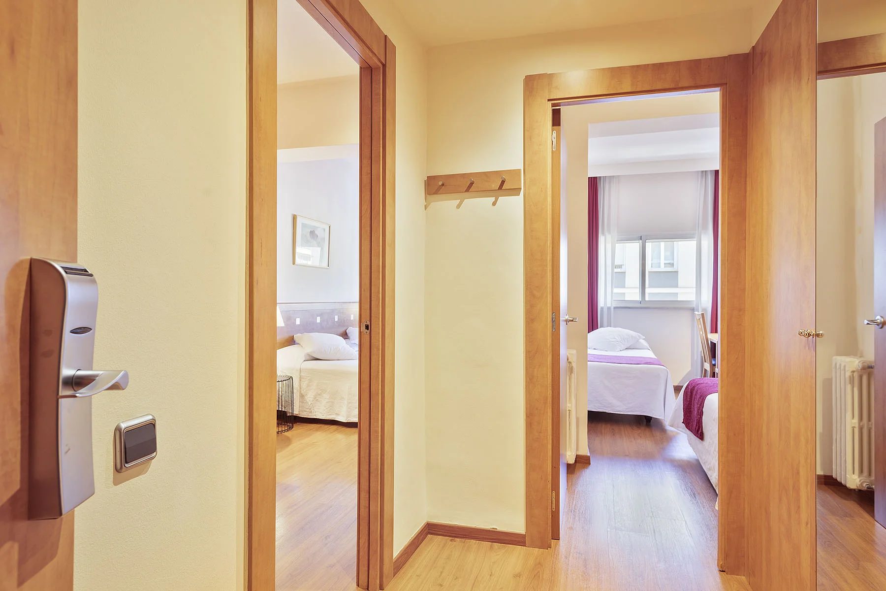 The hallway between the Quadruple room’s two sleeping spaces at Acta Antibes.
