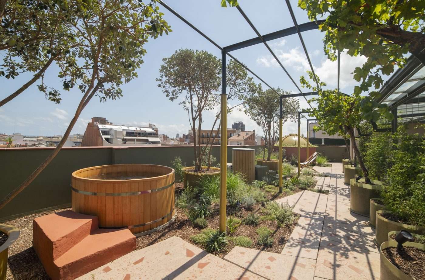 Wooden bathing tub on the planted Termas terrace at Casa Bonay.