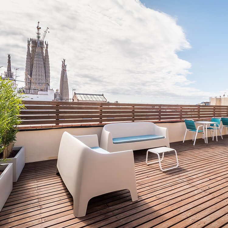 The shared terrace at Hotel Sagrada Família, with basilica spires beyond.