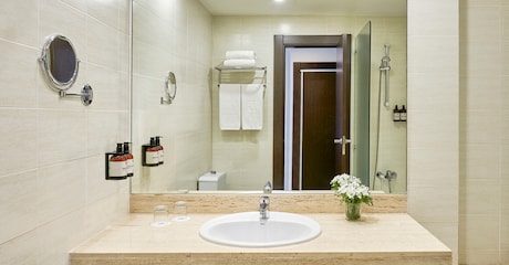 Basin and mirror in a bathroom at NH Barcelona Eixample.