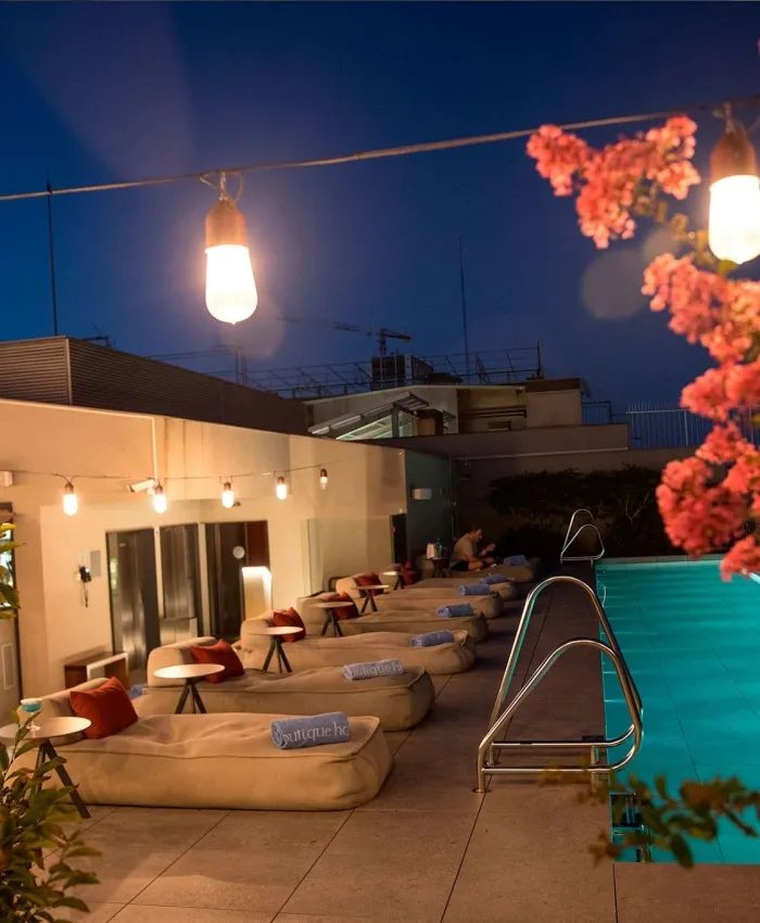 Ohla Eixample’s rooftop pool at dusk.