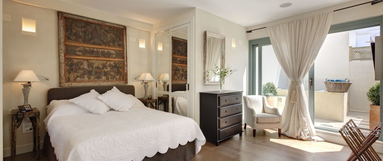 Penthouse Suite bedroom at Corral del Rey