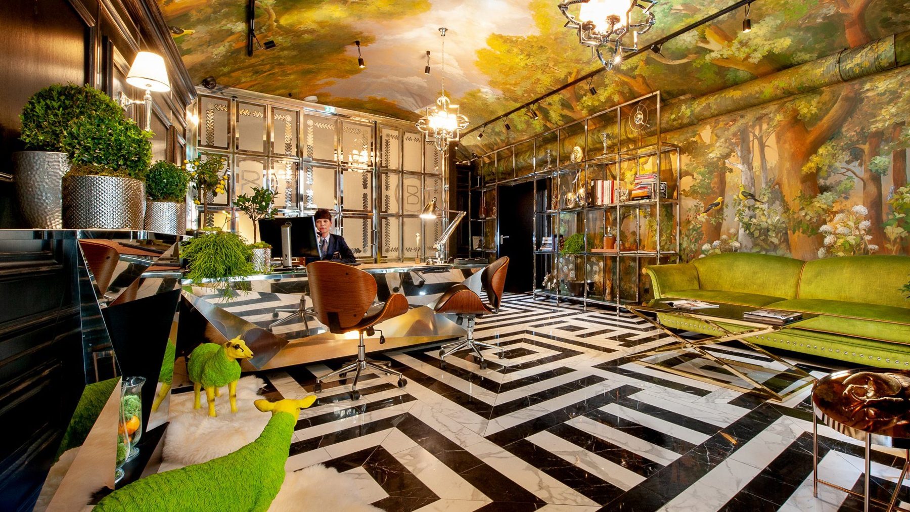 Balthazar reception with mirrored walls and a painted botanical ceiling.