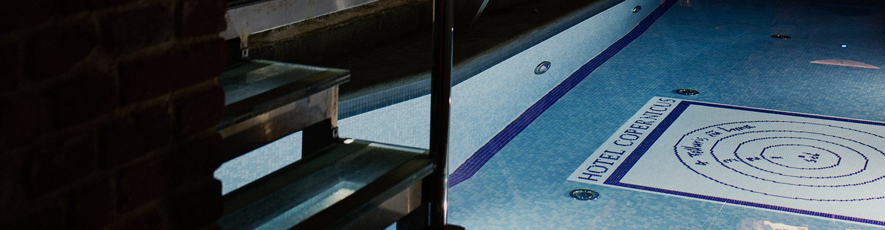 Steps into the tiled indoor pool at Hotel Copernicus.