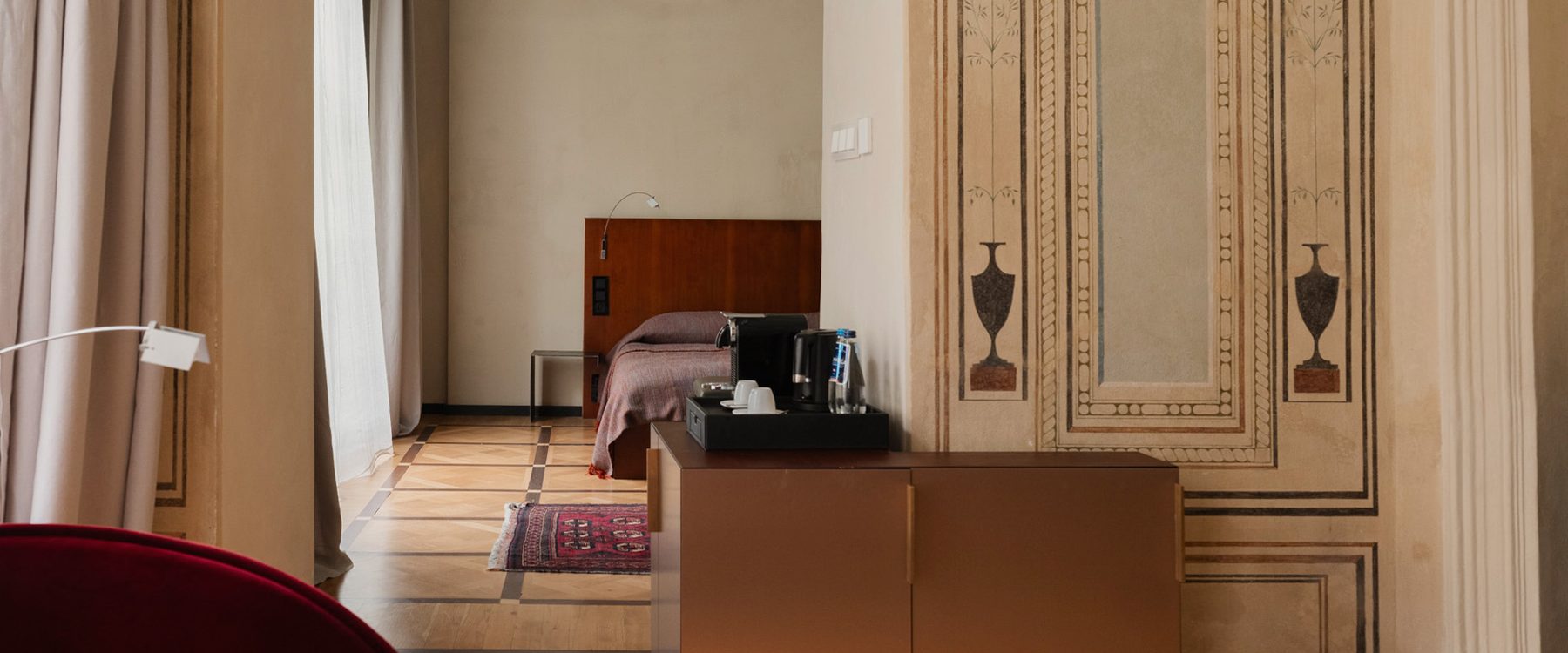 Bedroom and decorated interior panels at Hotel Pod Różą.