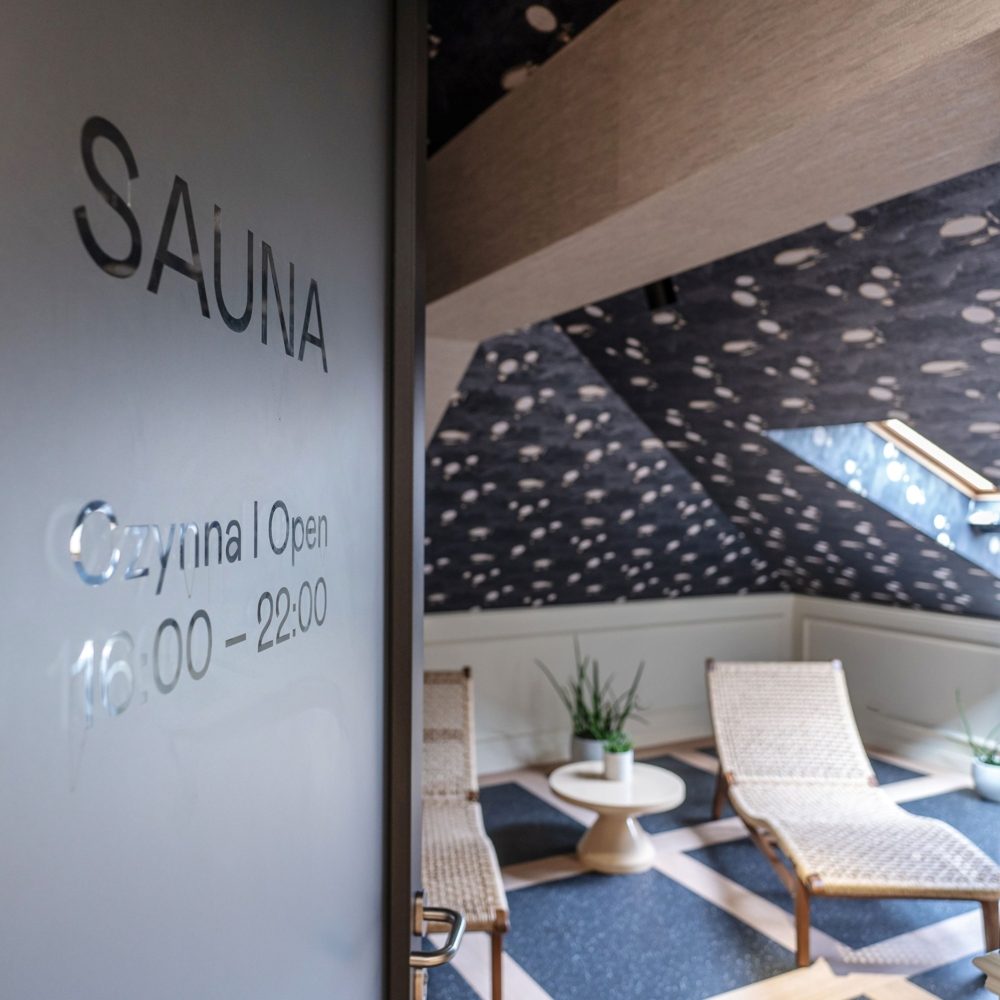 Sauna entrance and lounge chairs at Unicus Palace on Sławkowska.