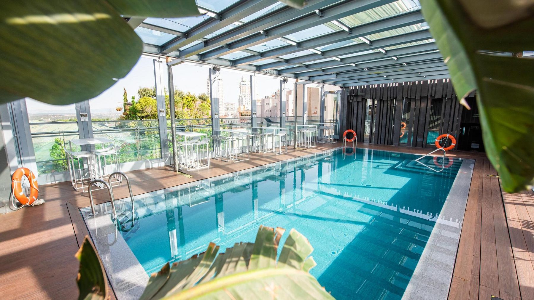 Rooftop swimming pool beneath a roof structure at Inhala Hotel Garden.