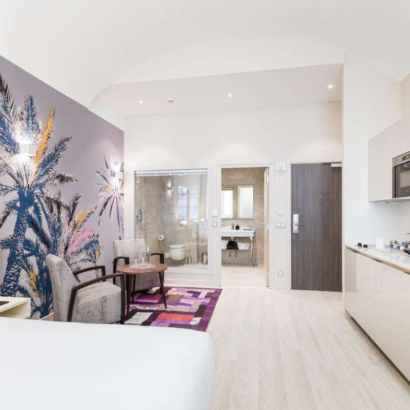 Kitchen counter beside the sleeping and sitting area in a Palais Saleya Junior Suite