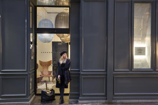 Dark façade and open entrance doors at Hôtel Dupond-Smith.