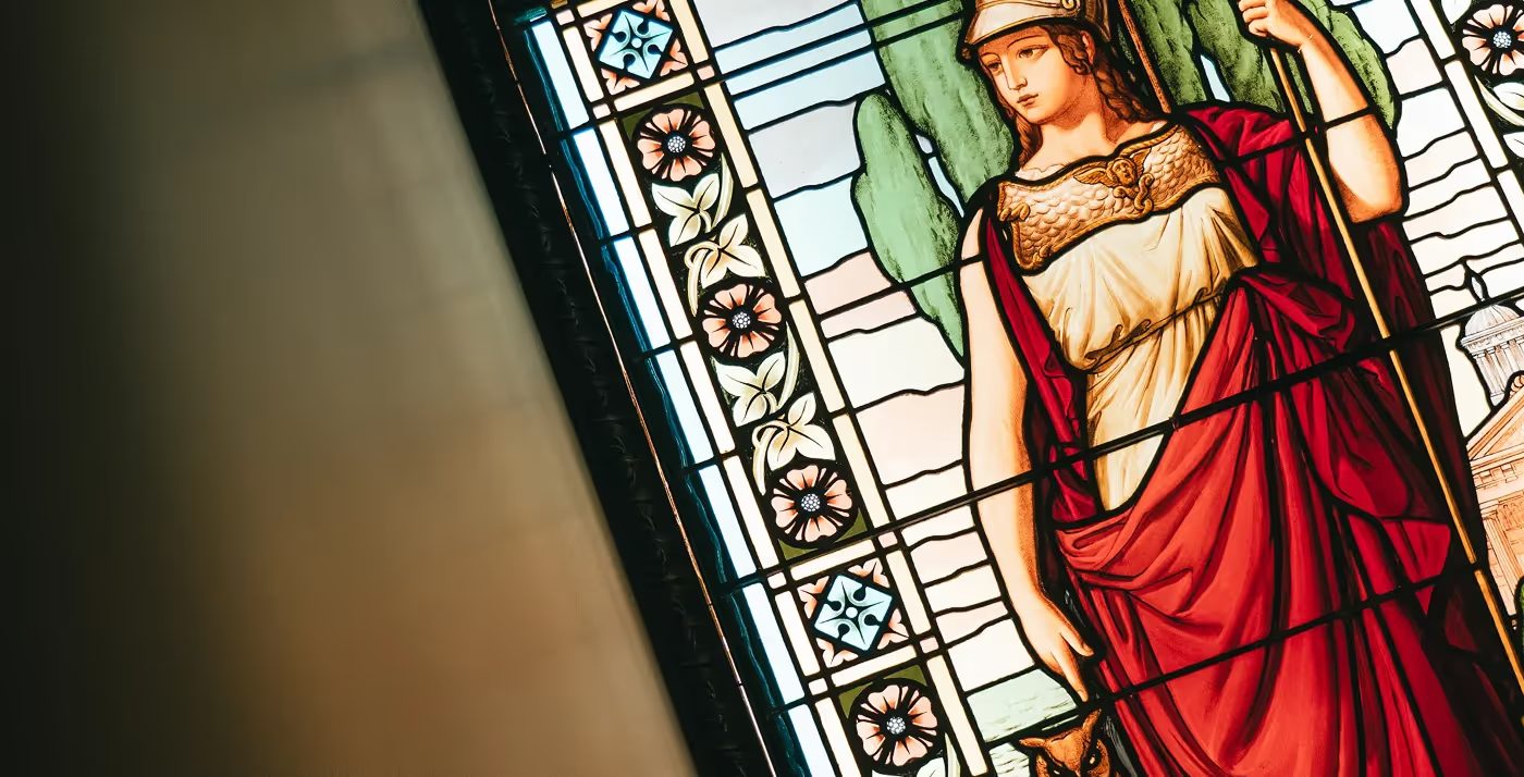 Colourful stained-glass figure and decorative leaded panes at Palacete Severo.