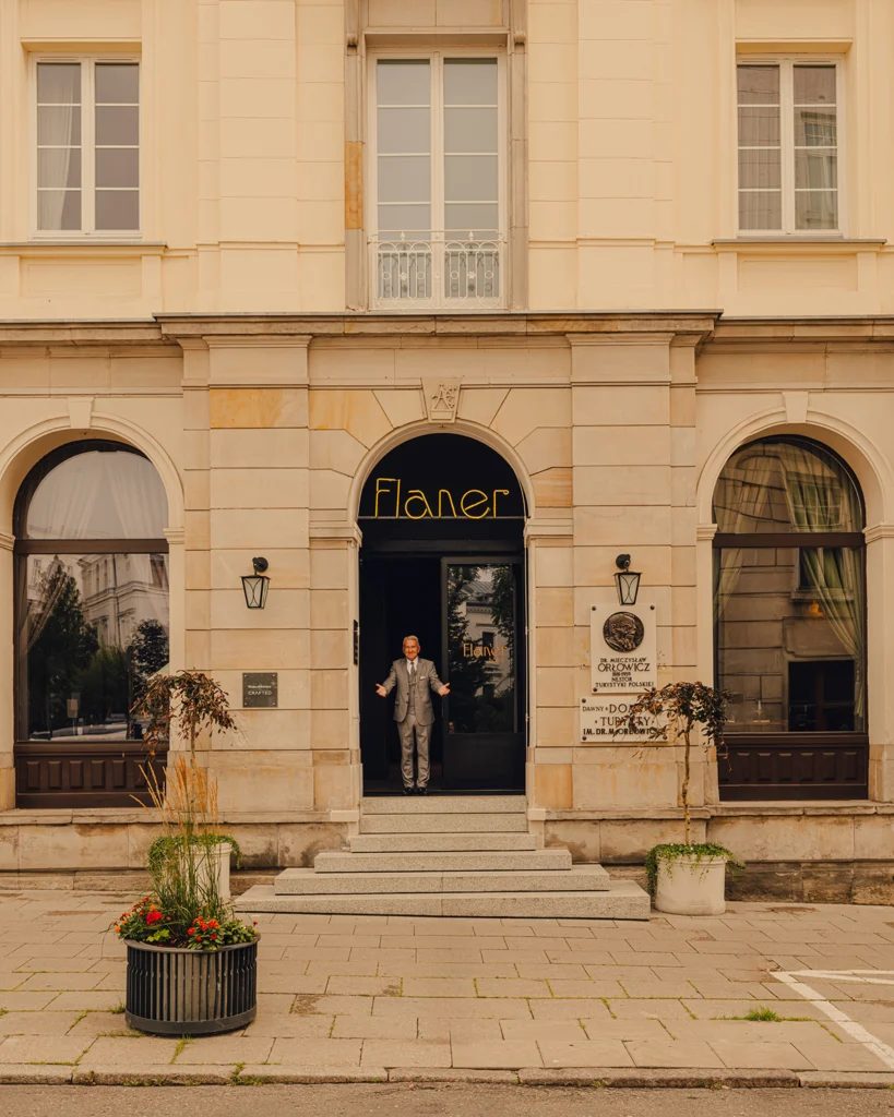 Steps leading to the signed entrance of Flaner Hotel