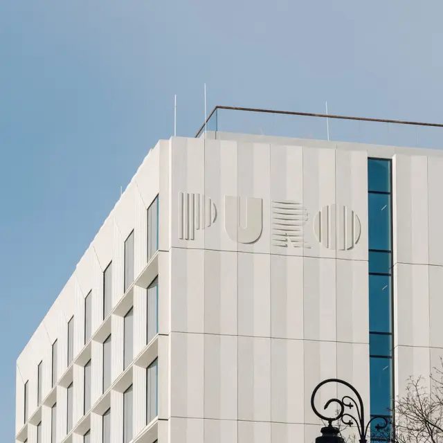 Pale facade with PURO lettering at Warsaw Old Town on Canaletta